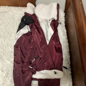 Maroon pull over , fully on the inside